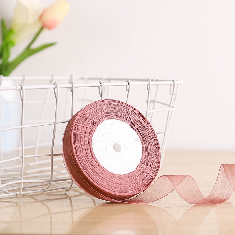 Dekoratyvinė juostelė - 50% viskozės ir 50% dirbtinės medvilnės mišinys; skirta drabužiams, namų tekstilei ir pramoninei naudojimui