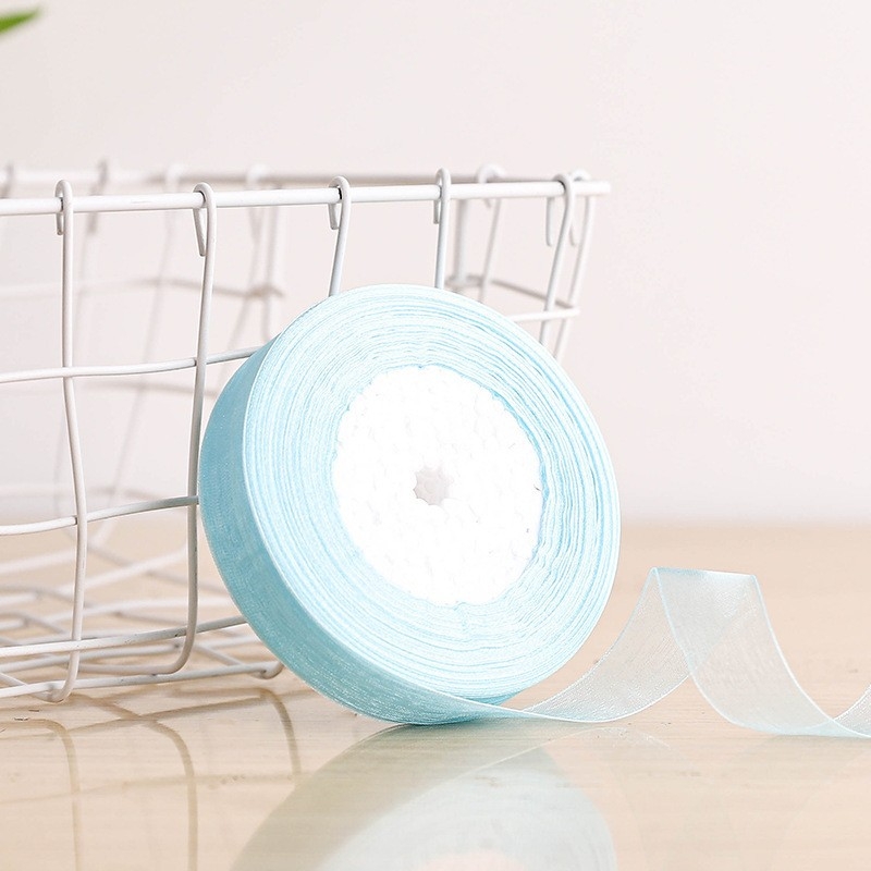 Dekoratyvinė juostelė - 50% viskozės ir 50% dirbtinės medvilnės mišinys; skirta drabužiams, namų tekstilei ir pramoninei naudojimui