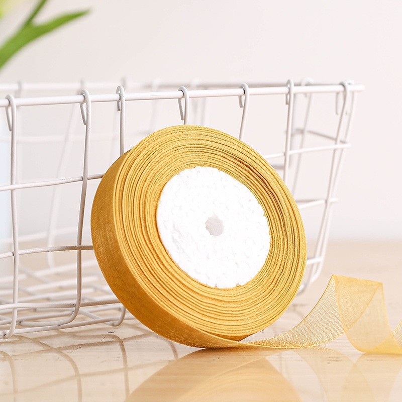 Dekoratyvinė juostelė - 50% viskozės ir 50% dirbtinės medvilnės mišinys; skirta drabužiams, namų tekstilei ir pramoninei naudojimui