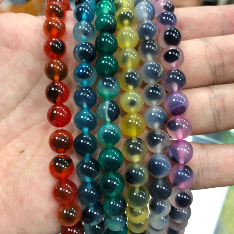 Karkötőkhöz való szabad gyöngyök: cukor-szív minta; kerek forma; agat anyag; feldolgozási technika vágás, csiszolás, polírozás; származás Yiwu