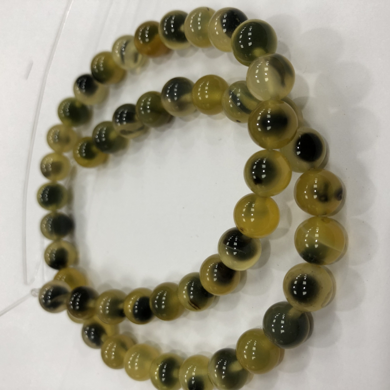 Karkötőkhöz való szabad gyöngyök: cukor-szív minta; kerek forma; agat anyag; feldolgozási technika vágás, csiszolás, polírozás; származás Yiwu