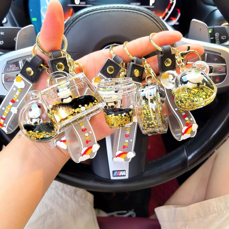 Lanț de chei din acril cu panda în lichid într-o sticluță, pandantiv desen animat