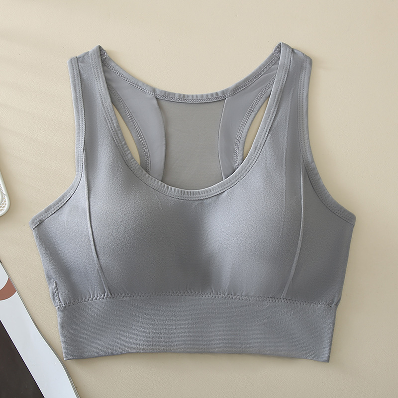 Sieviešu sporta topiņš, bezšuvju un neredzamu dizainu, ar pilnu krūšu kausu; forma ar plānu augšējo daļu un biezāku apakšdaļu; materiāls neilons 80–90%