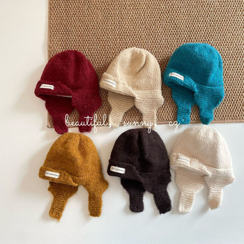 Gyerekek téli fülvédő kötött sapka fleece bélés, kupola alak, akril szál, 2025 tél