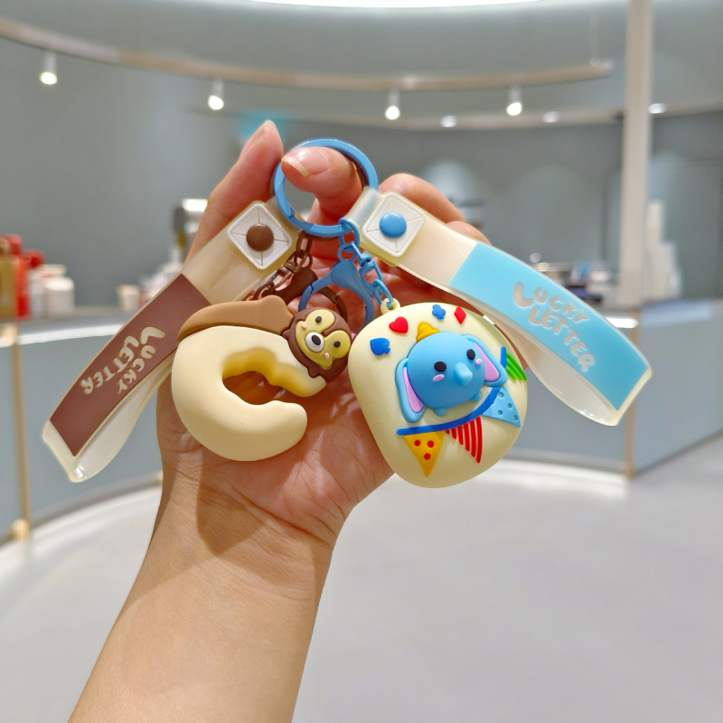 Silikonski privjesak za ključeve u karikaturalnom stilu, prilagodljiv za ruksak, poklon