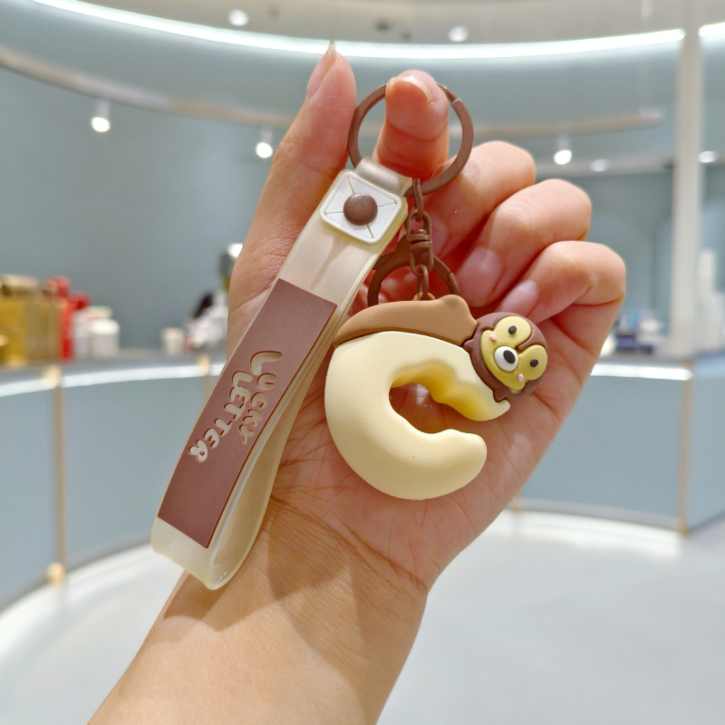Silikonski privjesak za ključeve u karikaturalnom stilu, prilagodljiv za ruksak, poklon