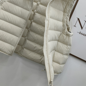 Sievietes pūka veste no neilona, pildījums gušču pūka, pūka saturs 86–90%, brīvs griezums, rāvējslēdzējs priekšā