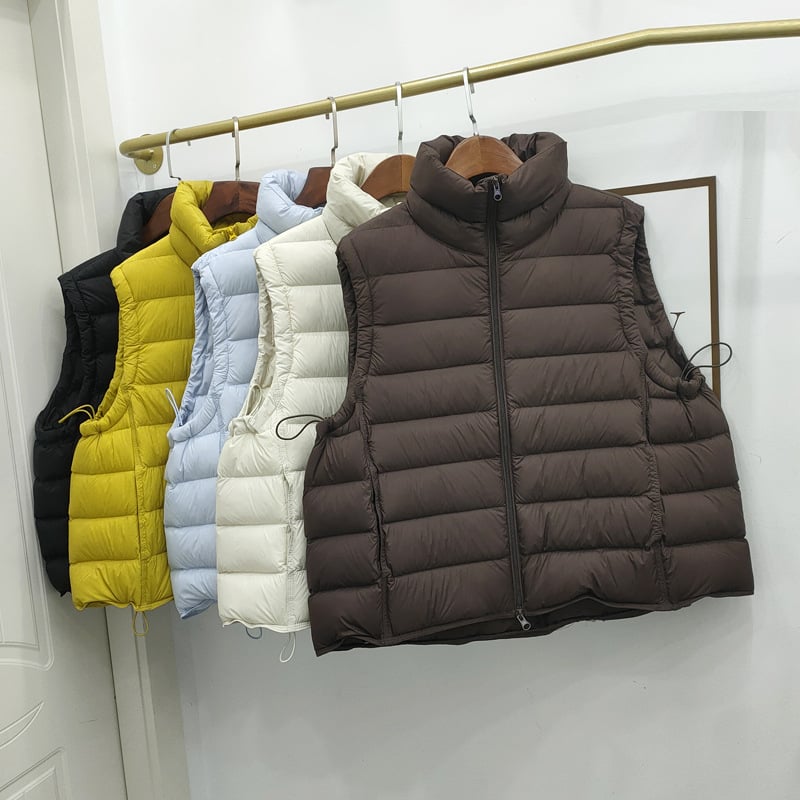 Sievietes pūka veste no neilona, pildījums gušču pūka, pūka saturs 86–90%, brīvs griezums, rāvējslēdzējs priekšā