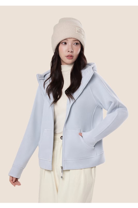 Női kapucnis laza szabású szélvédett kabát flockos textúrával, poliészter–spandex keverék