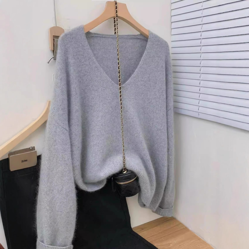 Vilnas pulovers, V kakls, garas piedurknes, parasts garums 50–65 cm, brīvs piegriezums