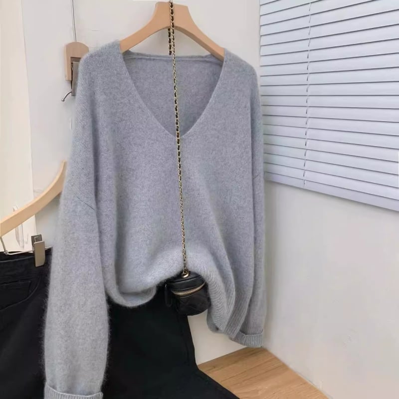 Vilnas pulovers, V kakls, garas piedurknes, parasts garums 50–65 cm, brīvs piegriezums