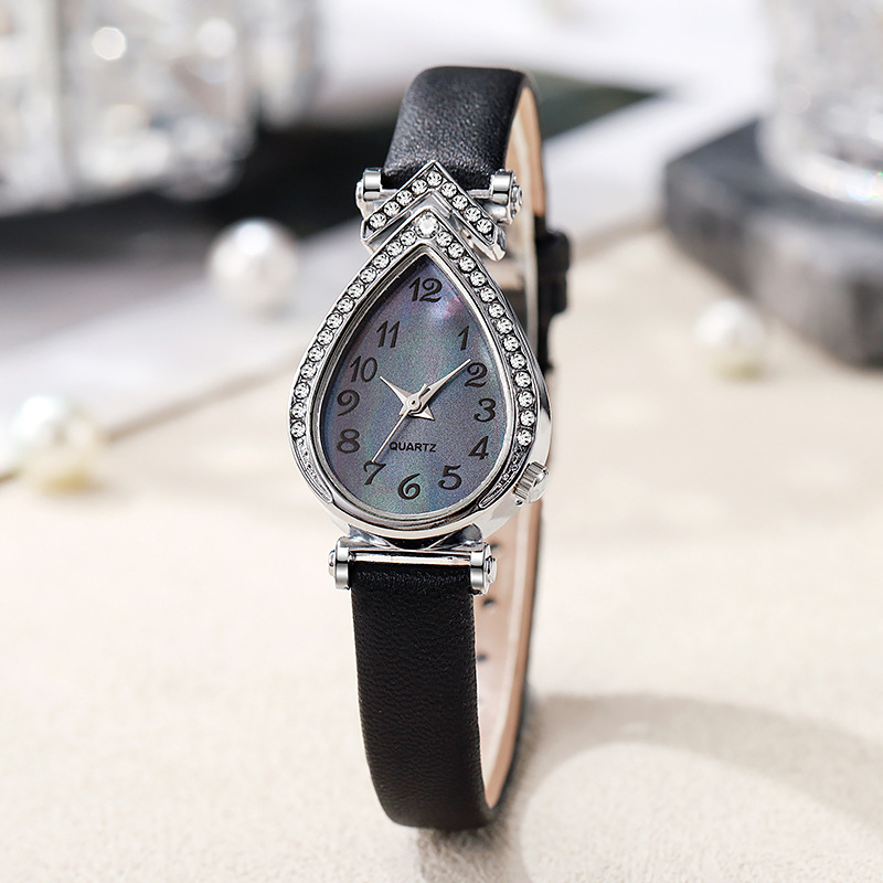 Női karóra vízcsepp alakú számlappal, kvarc működés, műbőr szíj, ötvözetes tokozás, rozsdamentes acél csat