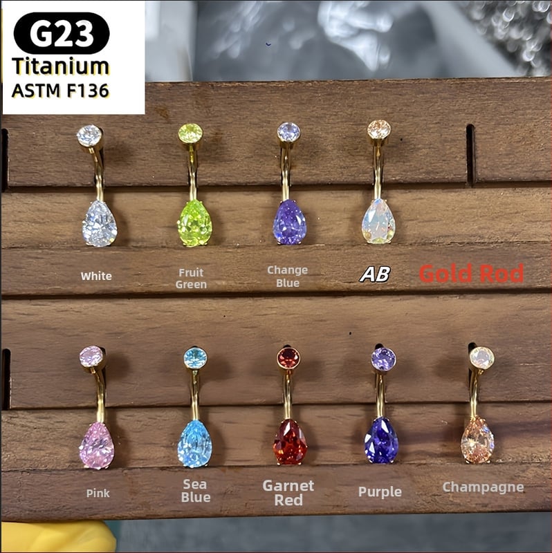 Nabelio žiedas – kriaušės formos lašas, 5A kubinis cirkonis, G23 titanas (ASTM F136), poliruotas