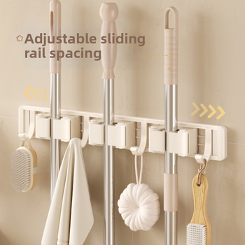 Stienā sienas plaukts mopam un slotai Crown Toon, materiāls: kosmiskais alumīnijs un plastmasa, uzstādīšana bez urbumiem, uzglabāšana mopas rokturiem, virsmas apdare: spreja plastmasa, svars 0,3 kg