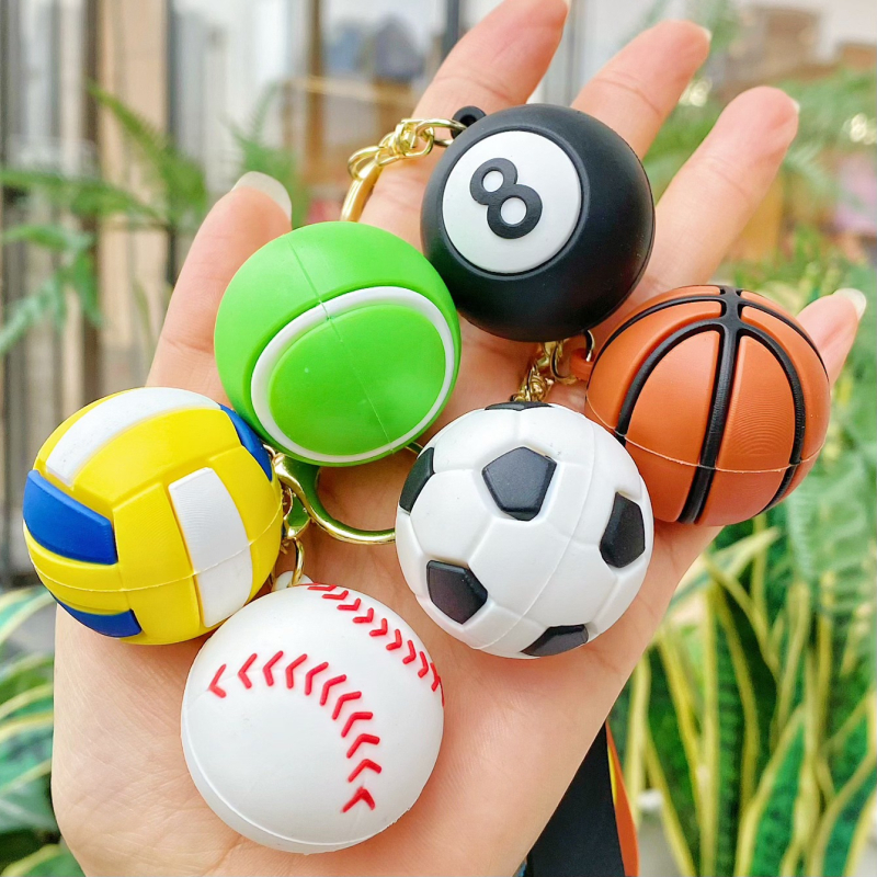 Kljucni lanac sa sportskim motivom Svjetskog prvenstva – crtani stil, mekani PVC materijal, privjesak lopta