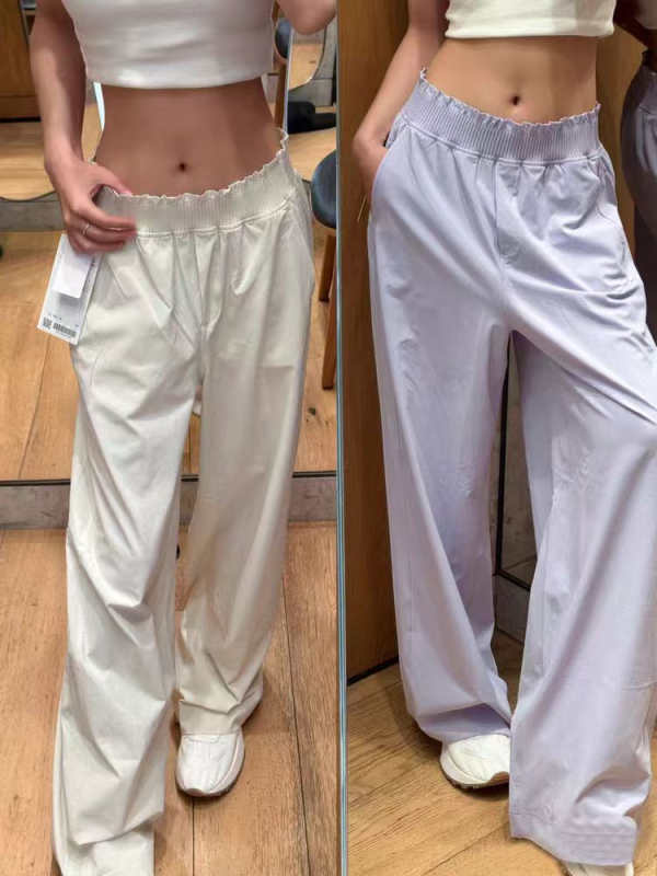 Sieviešu plašās sporta bikses skrējējiem ar ruļveidīgu elastīgo jostu, vidēji augstu jostas vietu, neilona audums, mitruma vadība