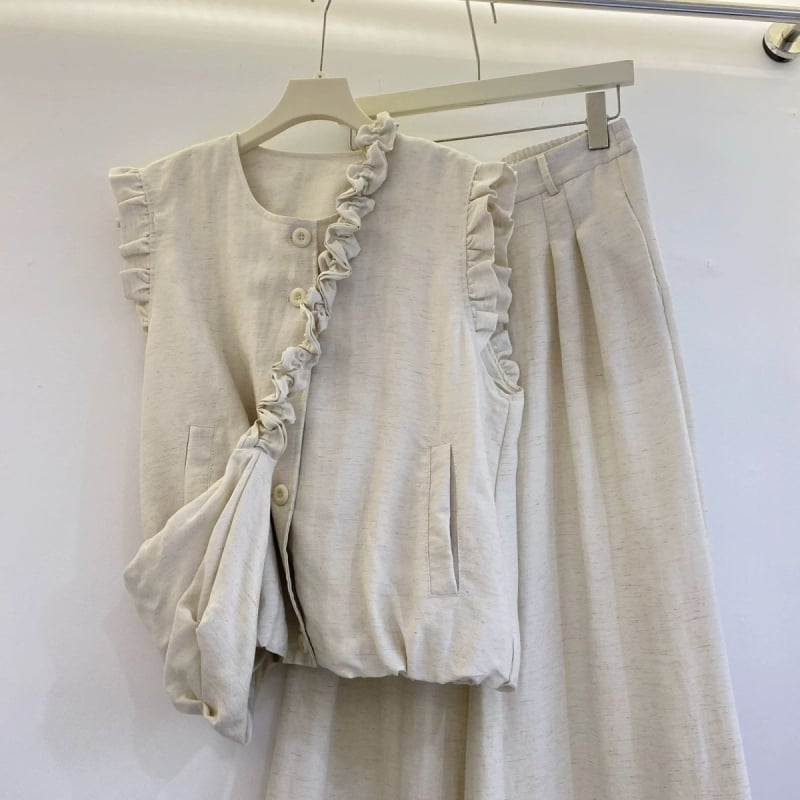 Kolmeosaline komplekt Koreaja stiilis: varrukateta vest ja laiad püksid, PVC-kangas, 2025 kevad