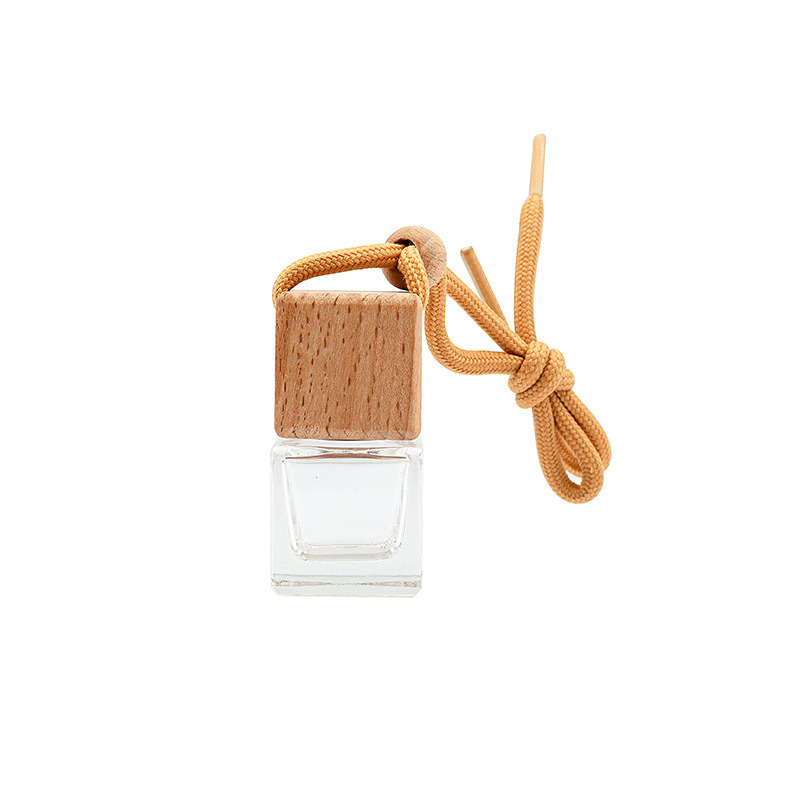 Stikla aromaterapijas pudele ar koka vāciņu un piekariņu auto atpakaļskata spogulim