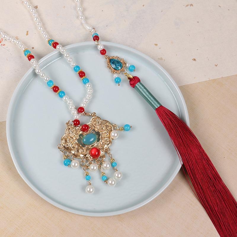 Kaklarota ar kulonu nacionālā stilā, metāla kvalitāte 0,4, tīrība K5, vecuma grupa 3–10 gadi, atsevišķi iepakots, Peach Sunseeker