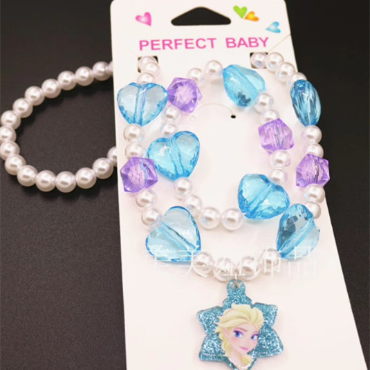 Bērnu kaklarotas un rokassprādzes komplekts ar pasakas princese motīvu — rezīns, atsevišķi iepakots, tīrība K5, 0,05 dārgmetāla kvalitāte, 2021. gada pavasaris