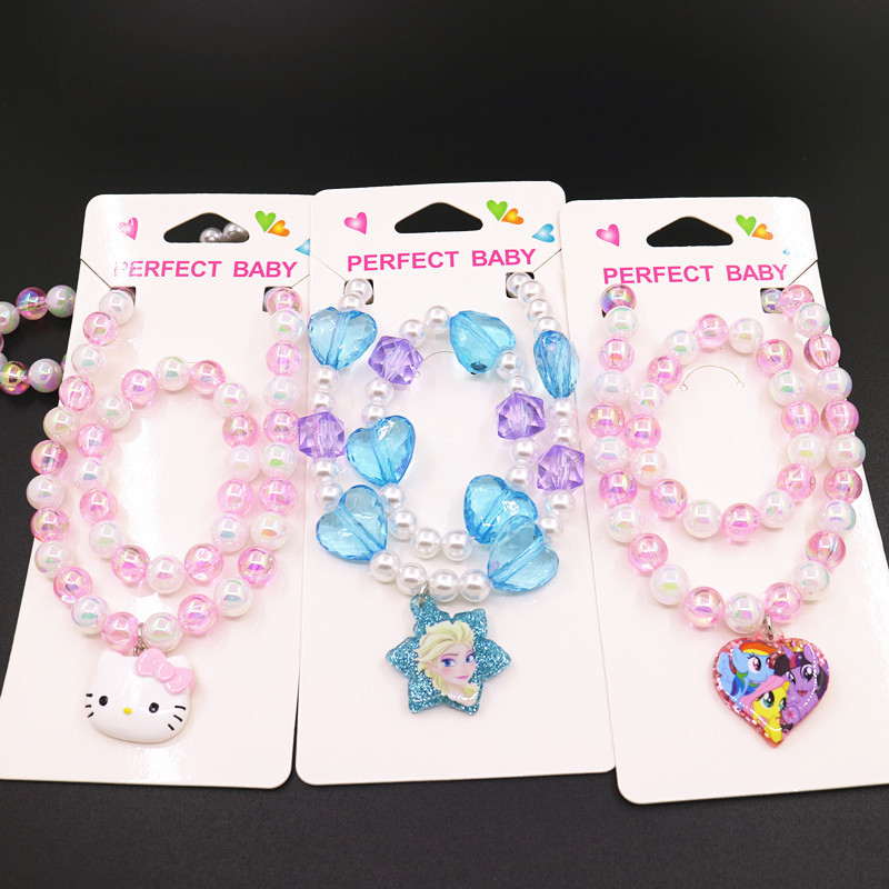 Bērnu kaklarotas un rokassprādzes komplekts ar pasakas princese motīvu — rezīns, atsevišķi iepakots, tīrība K5, 0,05 dārgmetāla kvalitāte, 2021. gada pavasaris