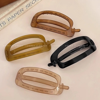 Spona za kosu – Elegantno, minimalističko dizajn; Materijal: plast/smola; Okretni klips; Obrada: pečena boja; Ljeto 2024