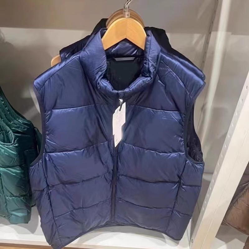 Unisex ziemas viegla pūka veste ar corduroy virsējā auduma, balta pīļu pūka 55–60% pilda, <100 g pildījums, kapuce, stāvošā apkakle, galvenais materiāls polipropilēns