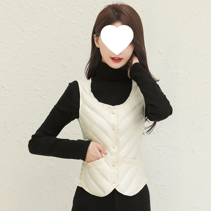 Sieviešu vilnas pildīta veste, V kakla izgriezums, ļoti īss siluets, vienas pogas aizdare, A-līnija, galvenais audums - rayon