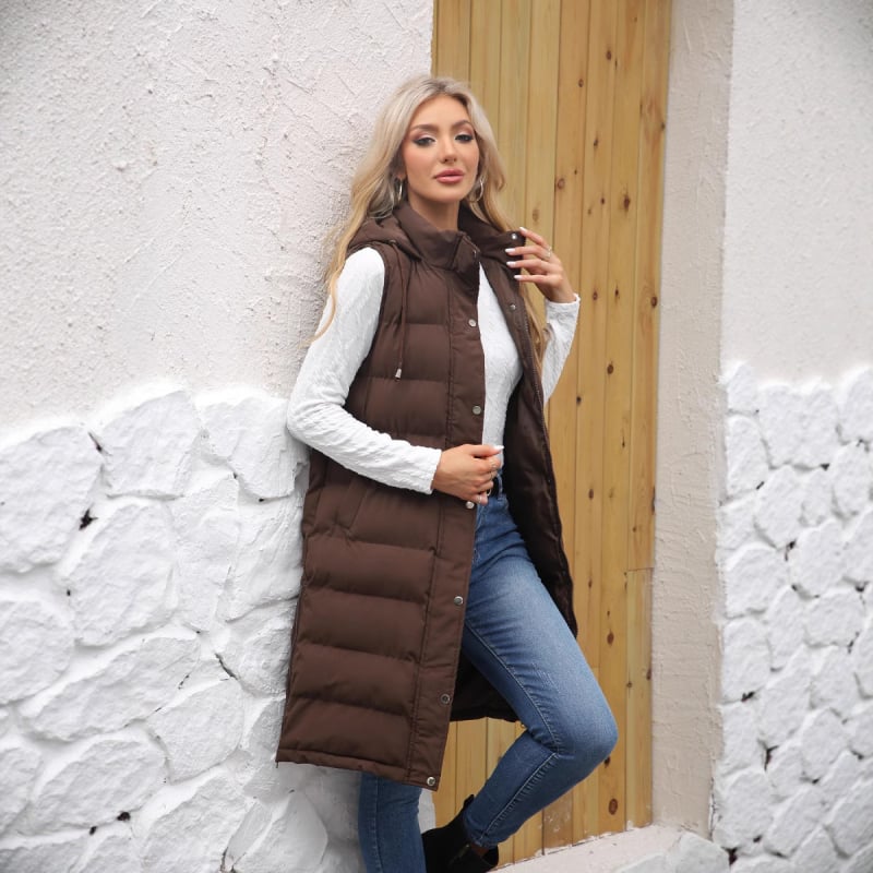 Pikk naiste vest kapuutsiga, paksendatud polüestri-puuvillase täite, polüestrist väline, ees tõmblukk, pikk lõige, ühekordne muster