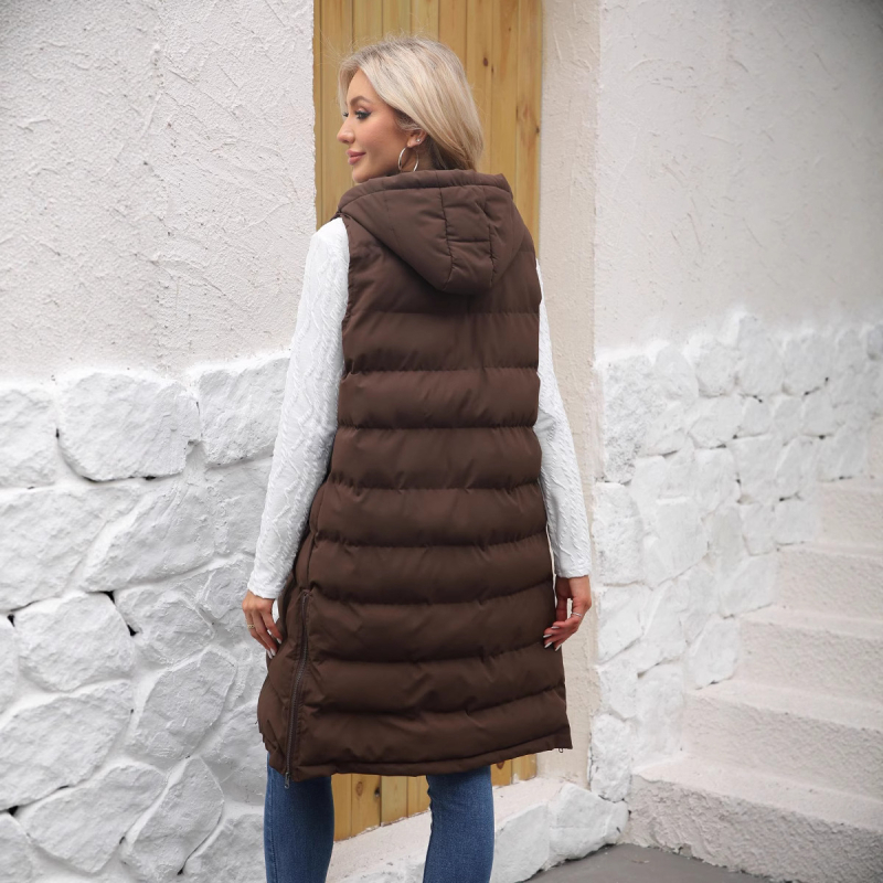 Pikk naiste vest kapuutsiga, paksendatud polüestri-puuvillase täite, polüestrist väline, ees tõmblukk, pikk lõige, ühekordne muster