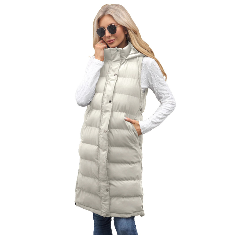 Pikk naiste vest kapuutsiga, paksendatud polüestri-puuvillase täite, polüestrist väline, ees tõmblukk, pikk lõige, ühekordne muster