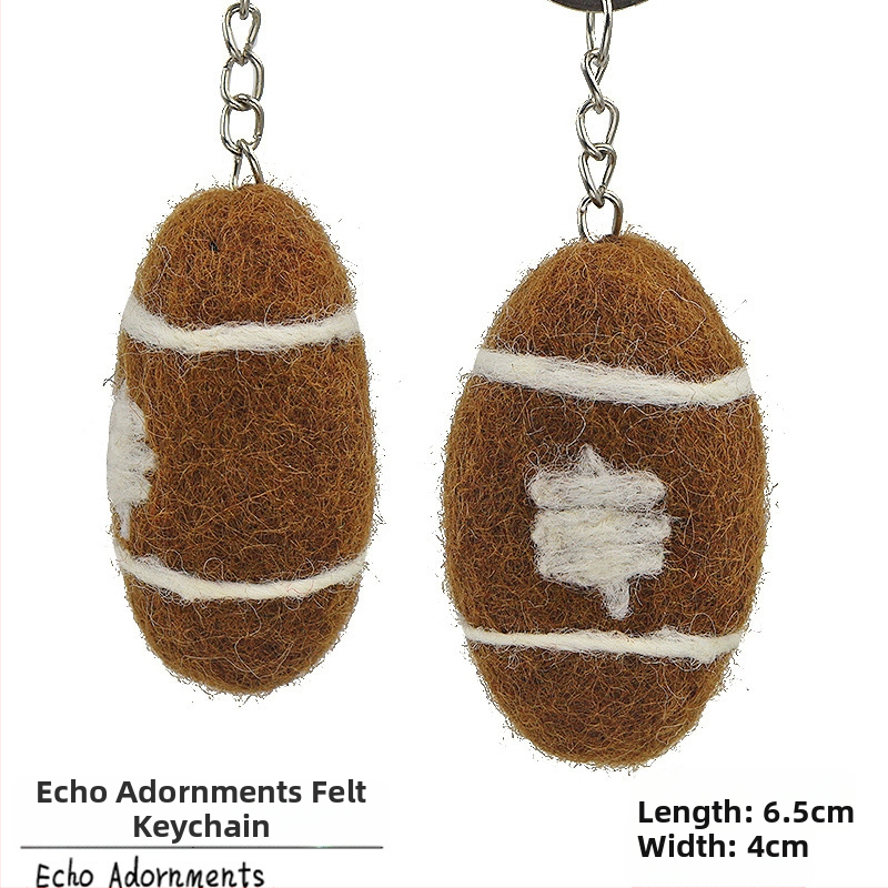 Atslēgu piekariņš no Nepāles vilnas filca – 3D futbols, basketbols un regbi, somas piekariņš no filca (Izcelsme Yiwu; roku darbs; vilna; vasara 2025)