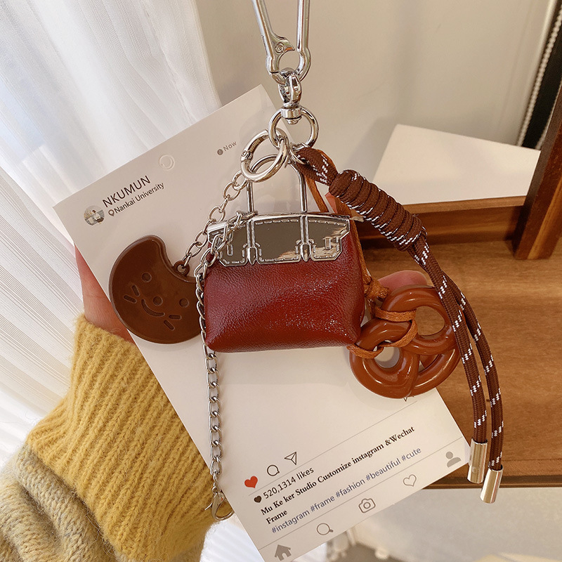 Κλειδοθήκη HD12123: σοκολατένιο μπέγκελ με ύφαντό σκοινί, διακοσμητικό για τσάντες, κορεατικό στυλ. Μάρκα Lemon Peach, μικτά υλικά.