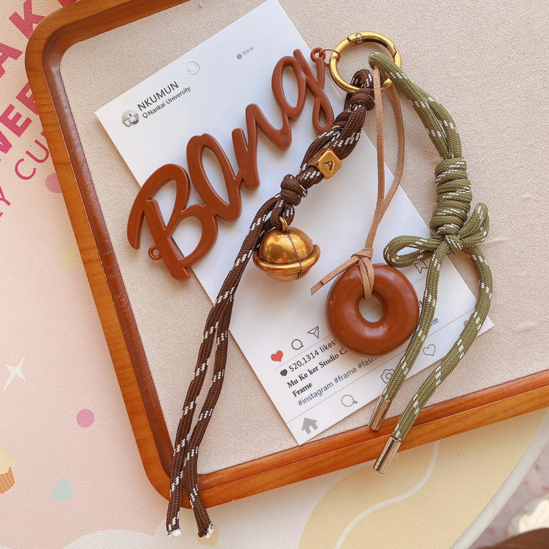 Κλειδοθήκη HD12123: σοκολατένιο μπέγκελ με ύφαντό σκοινί, διακοσμητικό για τσάντες, κορεατικό στυλ. Μάρκα Lemon Peach, μικτά υλικά.