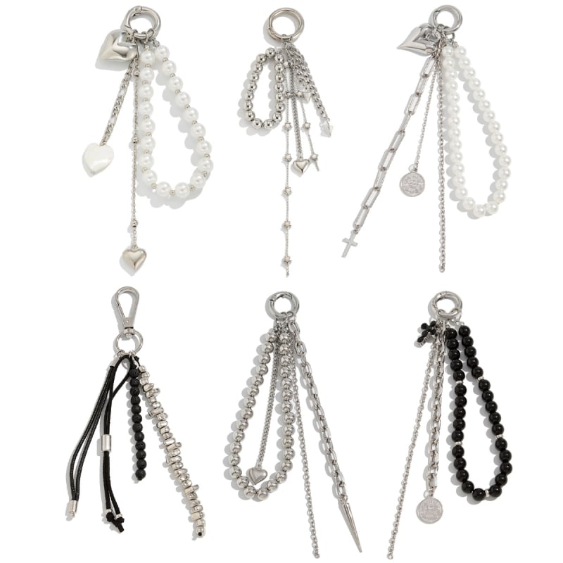 Sirds formas metāla atslēgu piekārts somai ar pērlīšu pītumu