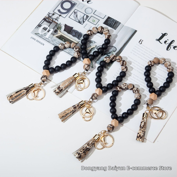 Silikona pirkstu rokassprādzes atslēgu piekariņš ar PU fiksu – leopardu raksts, dekoratīvs aksesuārs (Materiāls: Silikons; Stils: Dabas, Sievietes; Logo drukāšana: Iespējama; Forma: Cits; Funkcija: Dekorēšana)