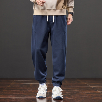 Férfiak számára lazán szabott melegítőnadrág, elasztikus derék, fleece béléses, kötött sportnadrág minden évszakra