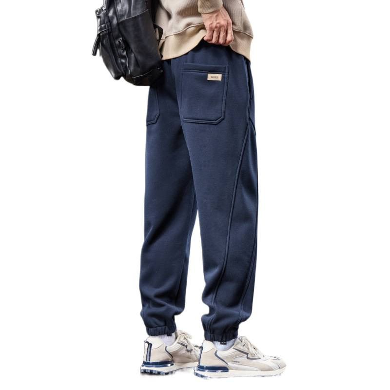 Férfiak számára lazán szabott melegítőnadrág, elasztikus derék, fleece béléses, kötött sportnadrág minden évszakra