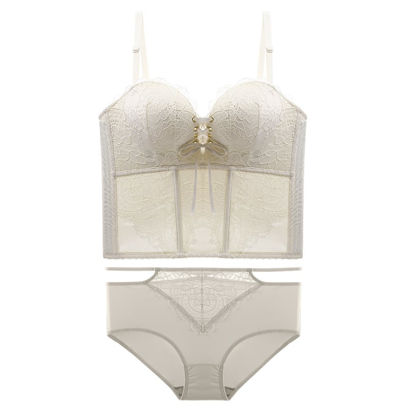 Bezšuvju veidojošs krūšturis kāzu kleitai — mežģīne uz neilona pamata, augšējie plānie un apakšējie biezāki veidojošie kausi, noņemamās dubultās siksnas, aizmugurē piecu rindu aizdare