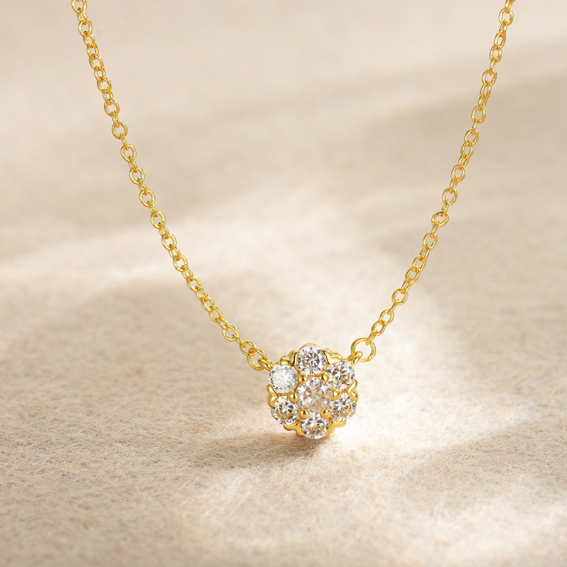 Női ékszerszett: virág motívum, keresztlánc, rézötvözet, elektroplattálás; tartalmaz nyakláncot, fülbevalót és karkötőt