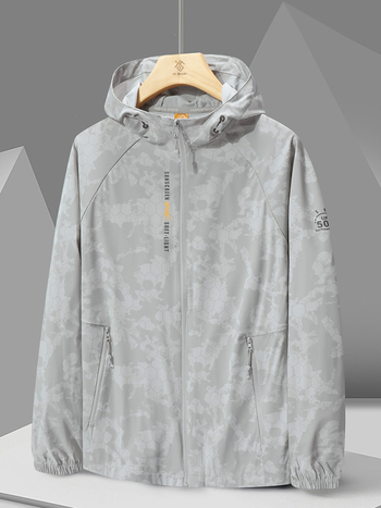 Ārējā vēja jaka 996 – universāla, UPF50+ UV aizsardzība, elpojoša un ļoti viegla, kamuflāžas modelis ar kapuci, poliesters