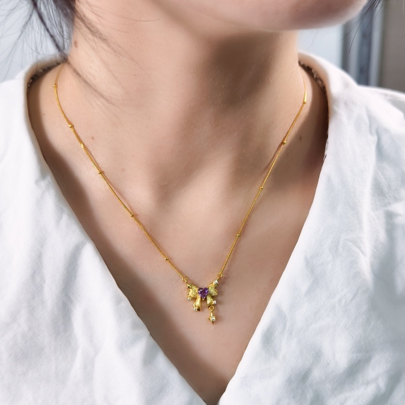 S925 ezüst masni alakú nyaklánc köves díszítéssel, többszintű keresztlánccal, szív alakú köves medállal