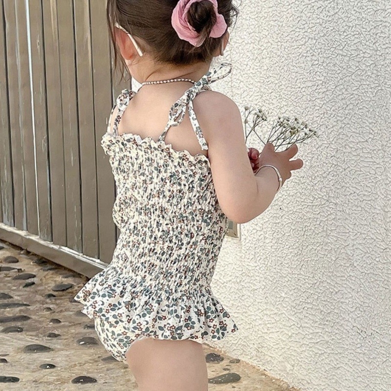 Mergaitėms: atviros nugaros viengabalis maudymosi kostiumėlis, karikatūrų raštas, amžius 0-8 metų, audinys: nailonas su elastanu