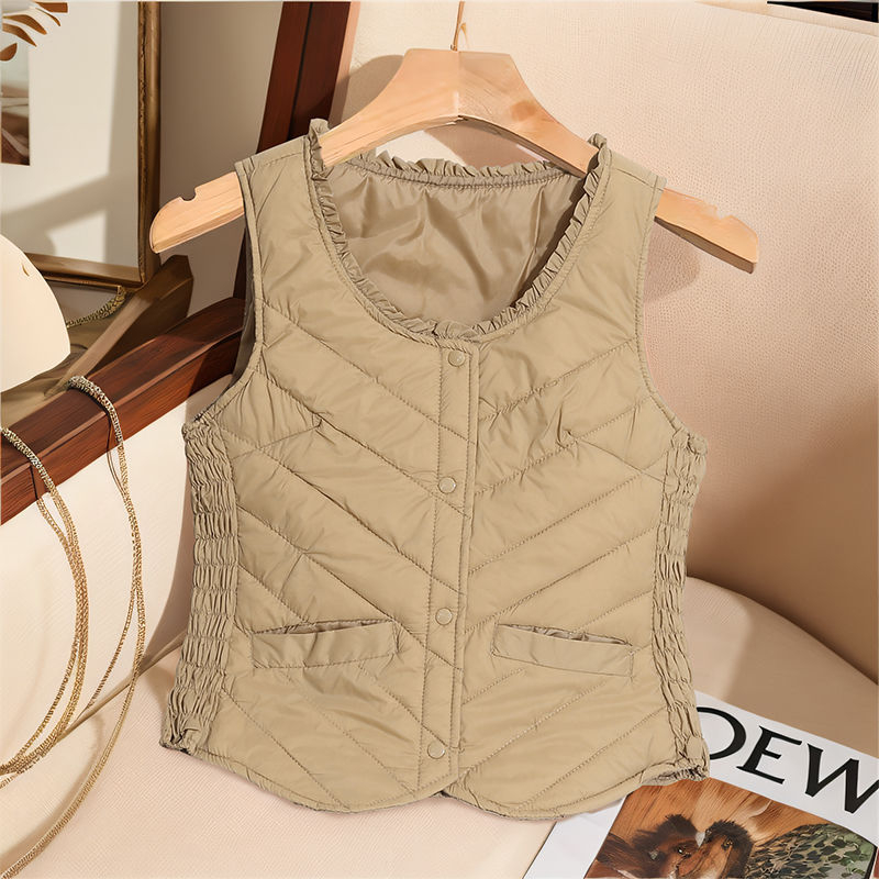 Sieviešu ultra īsa dūnu veste, bez piedurknēm, pildījums baltais pīļu dūns 81–85%