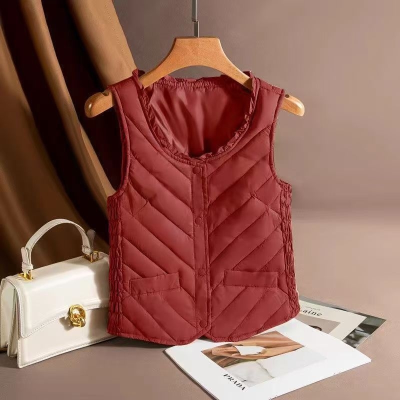 Sieviešu ultra īsa dūnu veste, bez piedurknēm, pildījums baltais pīļu dūns 81–85%