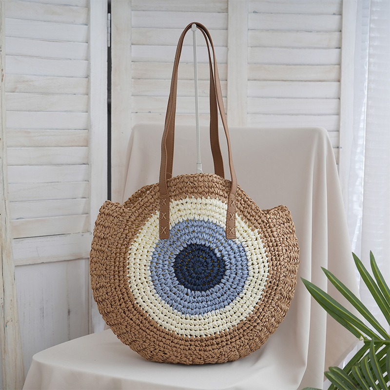 Ümmargune õlekõrrest kootud õla kott – linnalik lihtne stiil, tõmblukk kinnitusega, laminoid sisemus, üks õlarihm, kevad 2025