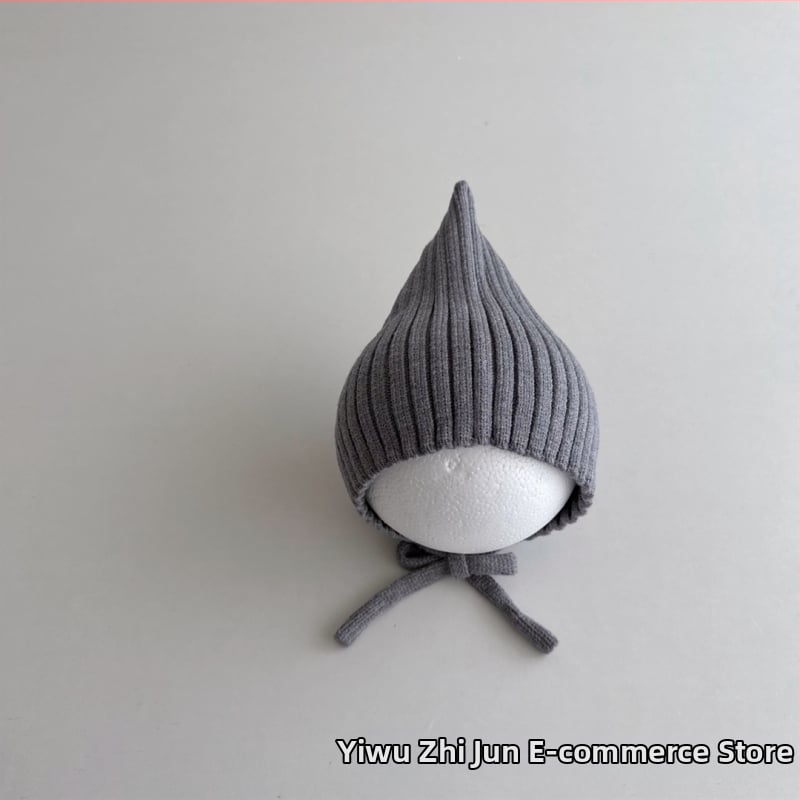 Adīta bērnu cepure ar smailu virsu un aizsargājošu siksnu, auss aizsardzība; silta un vēja izturīga ziemas cepure 6–12 mēnešiem