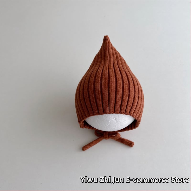 Adīta bērnu cepure ar smailu virsu un aizsargājošu siksnu, auss aizsardzība; silta un vēja izturīga ziemas cepure 6–12 mēnešiem