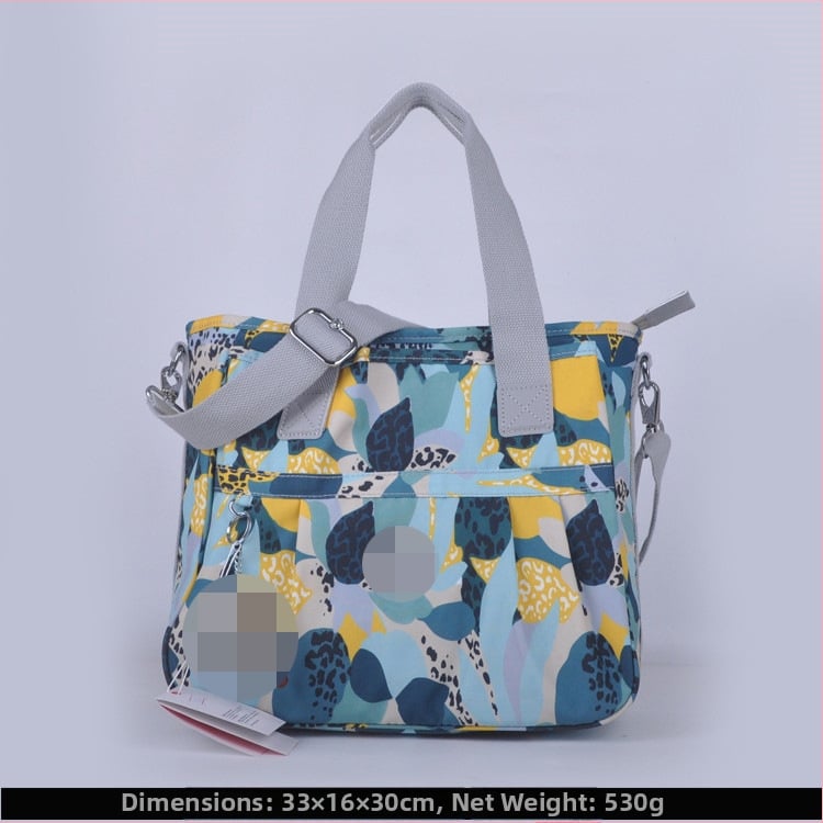 Õla kott crossbody – nailon, horisontaalne ruudu kuju, tõmblukukatte avamine, sisetaskud: tõmblukutasku, telefonitasku, ID-tasku, laminaat-tõmbluktasku, kaamera-tasku, vooder nailon