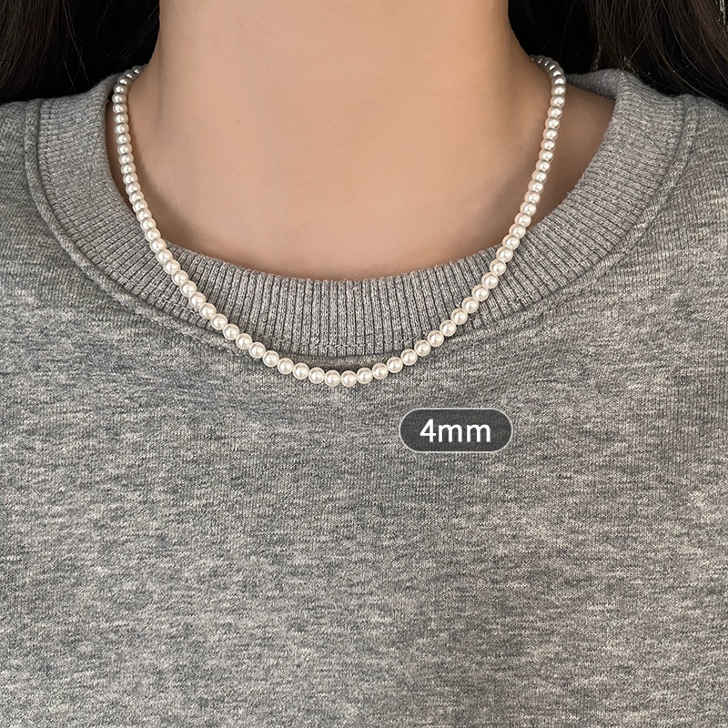 Gyöngy nyaklánc gyöngyház medállal, U-formájú kialakítás, Seiko kezelés, egyszerű, texturált, könnyed luxus stílus